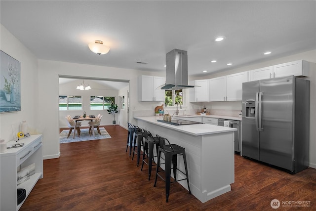 5505 Windemere Dr SE, Olympia, WA 98501 - kitchen featuring stainless steel appliances, island exhaust hood, a chandelier, a kitchen breakfast bar, and white cabinets