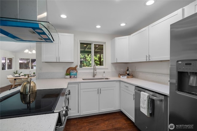 5505 Windemere Dr SE, Olympia, WA 98501 - kitchen featuring stainless steel appliances, a sink, white cabinets, a chandelier, and recessed lighting