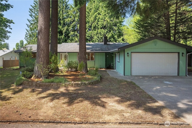 5505 Windemere Dr SE, Olympia, WA 98501 - ranch-style house with an attached garage, a chimney, and concrete driveway