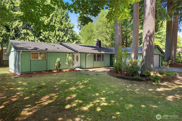5505 Windemere Dr SE, Olympia, WA 98501 - ranch-style house with a chimney, a front yard, a detached garage, roof with shingles, and driveway