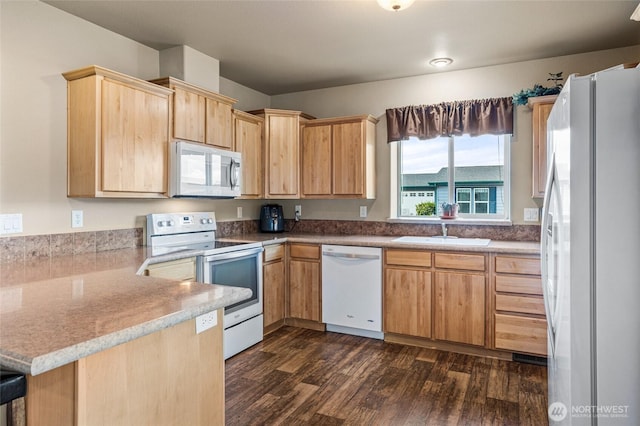 200 Bridle Way Unit 249, Yakima, WA 98901 - kitchen with white appliances, a peninsula, light brown cabinetry, dark wood finished floors, and a sink