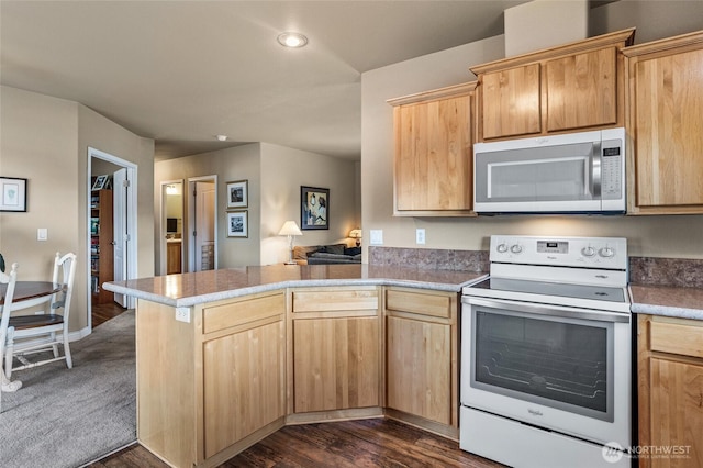 200 Bridle Way Unit 249, Yakima, WA 98901 - kitchen with white electric range oven, stainless steel microwave, a peninsula, light brown cabinets, and recessed lighting