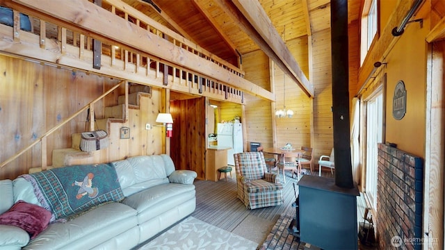 90B Moore Dr, Riverside, WA 98849 - living area with wooden walls, wooden ceiling, carpet flooring, a wood stove, and stairway