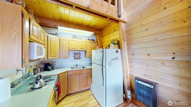 90B Moore Dr, Riverside, WA 98849 - kitchen with white appliances, a sink, light countertops, wooden walls, and wood ceiling with exposed beams