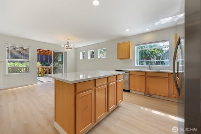 3147 6th Ave NW, Olympia, WA 98502 - kitchen featuring stainless steel appliances, a sink, light wood-style floors, plenty of natural light, and recessed lighting