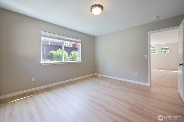 3147 6th Ave NW, Olympia, WA 98502 - spare room featuring light wood-type flooring, baseboards, and a smoke detector