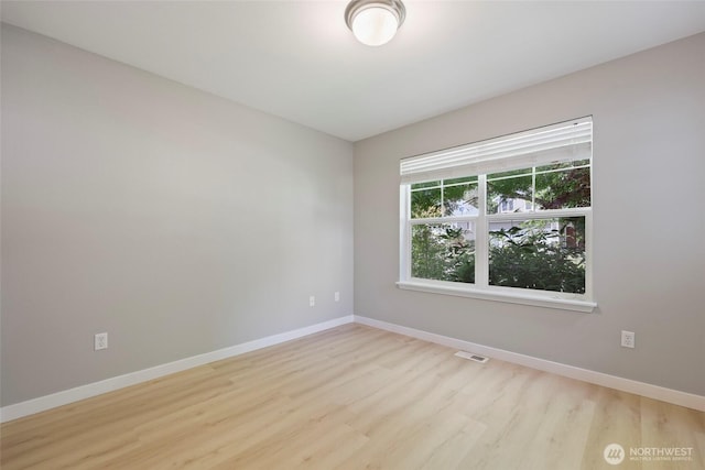 3147 6th Ave NW, Olympia, WA 98502 - unfurnished room with wood finished floors and baseboards