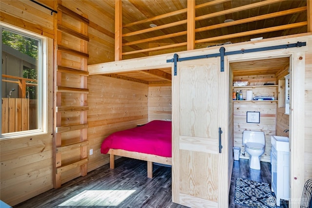 64 Eliza Is, Bellingham, WA 98226 - bedroom with wood walls, a barn door, wood finished floors, and wood ceiling