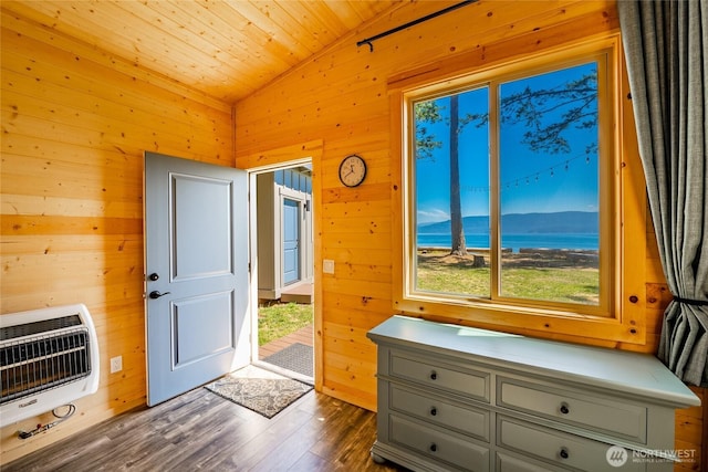 64 Eliza Is, Bellingham, WA 98226 - entryway with heating unit, lofted ceiling, wood walls, dark wood-style floors, and a water view