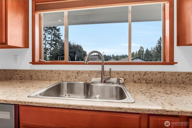 8402 57th Ave E, Puyallup, WA 98371 - kitchen with a sink and brown cabinetry