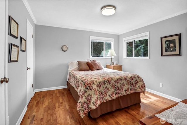 8402 57th Ave E, Puyallup, WA 98371 - bedroom featuring ornamental molding, baseboards, and wood finished floors
