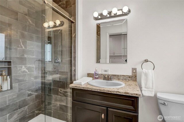 8402 57th Ave E, Puyallup, WA 98371 - full bath featuring tiled shower, vanity, and toilet