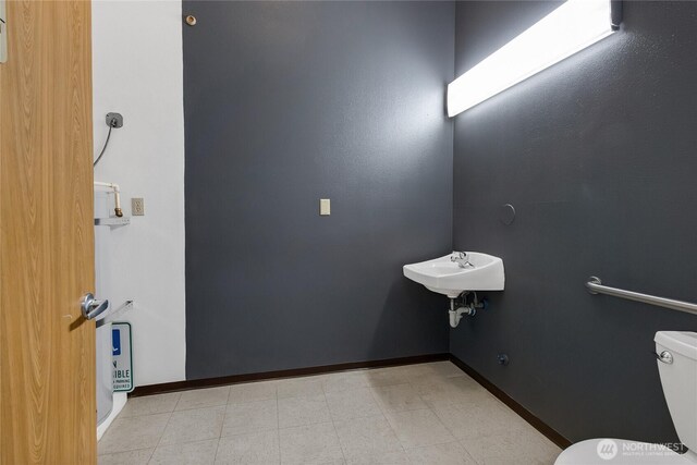 8402 57th Ave E, Puyallup, WA 98371 - half bath with toilet, baseboards, and a sink