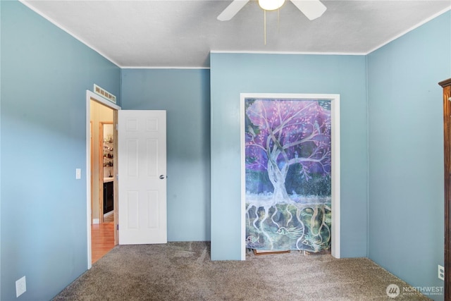 140 Leland Rd, Longview, WA 98632 - unfurnished bedroom featuring carpet, ornamental molding, and ceiling fan