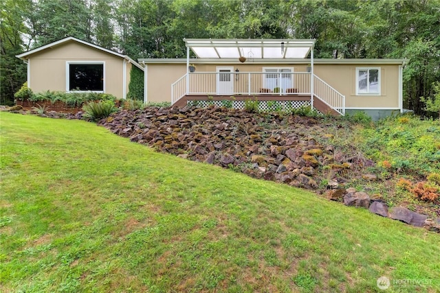 140 Leland Rd, Longview, WA 98632 - ranch-style home with a front yard, a wooden deck, and stairway