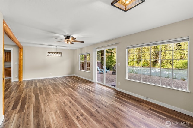 25921 Clear Creek Rd, Darrington, WA 98241 - unfurnished room with ceiling fan, baseboards, and wood finished floors
