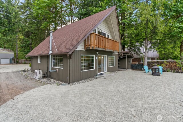 25921 Clear Creek Rd, Darrington, WA 98241 - chalet / cabin featuring a shingled roof and an outbuilding