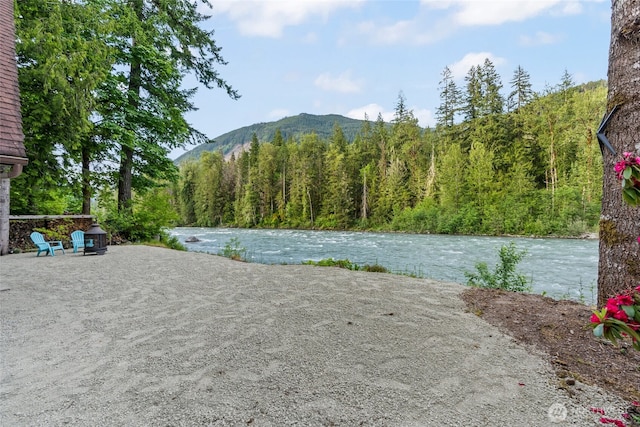 25921 Clear Creek Rd, Darrington, WA 98241 - water view with a mountain backdrop and a forest