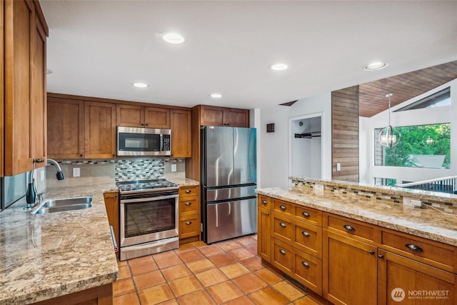 4119 NE 142nd St, Seattle, WA 98125 - kitchen with appliances with stainless steel finishes, brown cabinets, tasteful backsplash, and recessed lighting