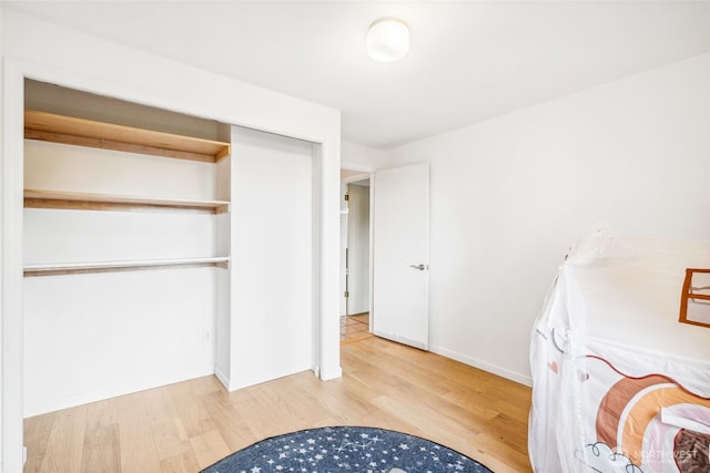 4119 NE 142nd St, Seattle, WA 98125 - laundry area featuring wood finished floors and baseboards
