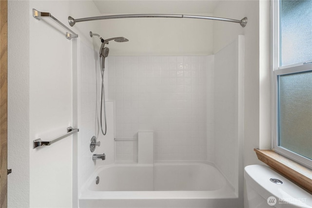 502 NW Alexander Ct, Orting, WA 98360 - bathroom featuring toilet and washtub / shower combination