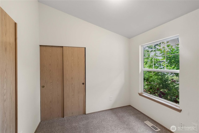 502 NW Alexander Ct, Orting, WA 98360 - unfurnished bedroom featuring carpet floors and a closet