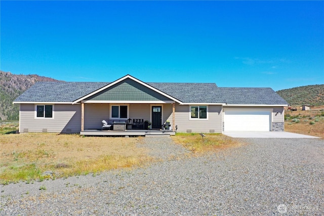 212 Hubbard Rd, Riverside, WA 98849 - ranch-style home with driveway, a garage, a porch, a mountain view, and crawl space