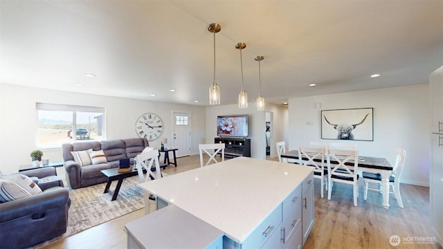 212 Hubbard Rd, Riverside, WA 98849 - kitchen featuring open floor plan, a center island, light wood finished floors, pendant lighting, and recessed lighting