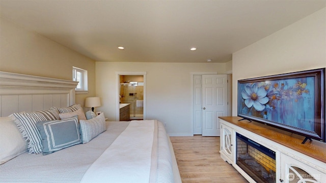 212 Hubbard Rd, Riverside, WA 98849 - bedroom with light wood-style flooring, recessed lighting, and ensuite bath