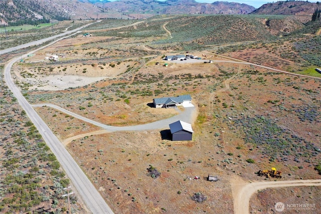 212 Hubbard Rd, Riverside, WA 98849 - aerial view of property's location featuring a mountainous background and rural landscape