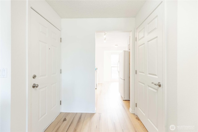 1755 W Sunn Fjord Ln Unit D65, Bremerton, WA 98312 - corridor with light wood-type flooring and baseboards