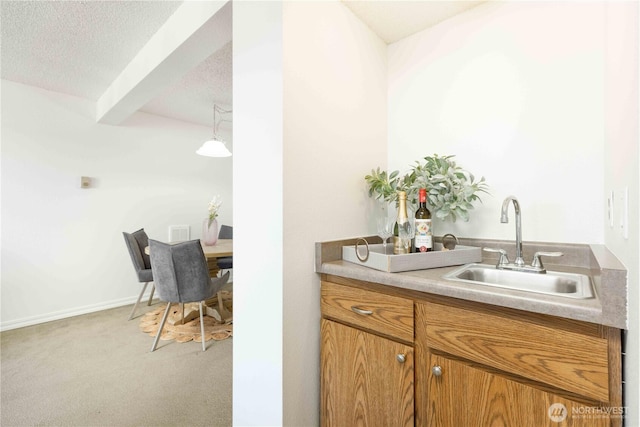 1755 W Sunn Fjord Ln Unit D65, Bremerton, WA 98312 - bar featuring a sink, light carpet, and a textured ceiling