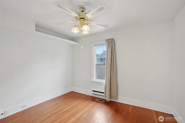 636 20th Ave, Longview, WA 98632 - empty room featuring hardwood / wood-style floors, ceiling fan, and baseboard heating