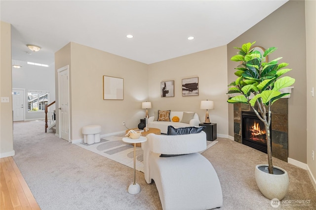 27677 256th Pl SE, Maple Valley, WA 98038 - living room featuring a fireplace, carpet floors, baseboards, recessed lighting, and stairs