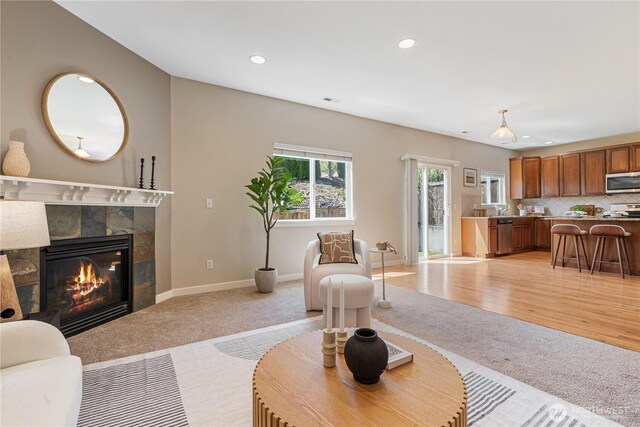 27677 256th Pl SE, Maple Valley, WA 98038 - living area featuring light colored carpet, recessed lighting, a tile fireplace, and baseboards