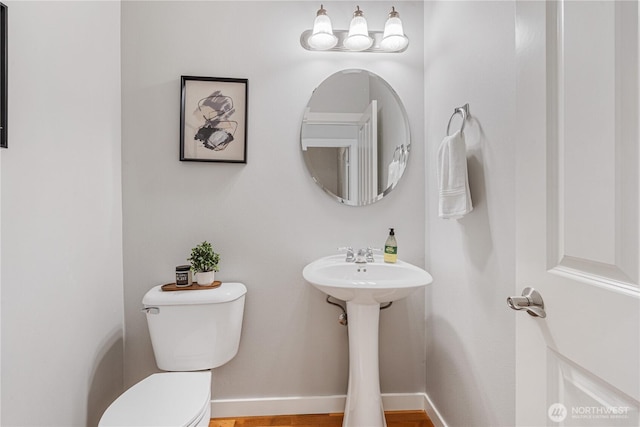 27677 256th Pl SE, Maple Valley, WA 98038 - half bathroom with toilet, wood finished floors, and baseboards