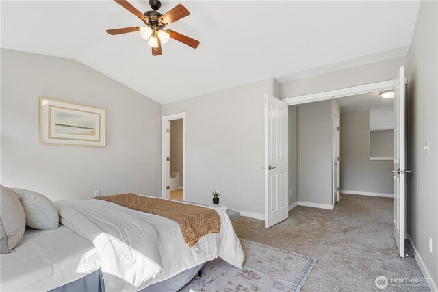 27677 256th Pl SE, Maple Valley, WA 98038 - bedroom with vaulted ceiling, light carpet, baseboards, ceiling fan, and connected bathroom