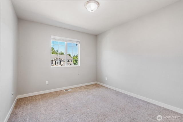 27677 256th Pl SE, Maple Valley, WA 98038 - spare room featuring carpet flooring and baseboards