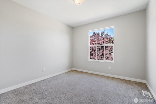 27677 256th Pl SE, Maple Valley, WA 98038 - spare room featuring carpet flooring and baseboards