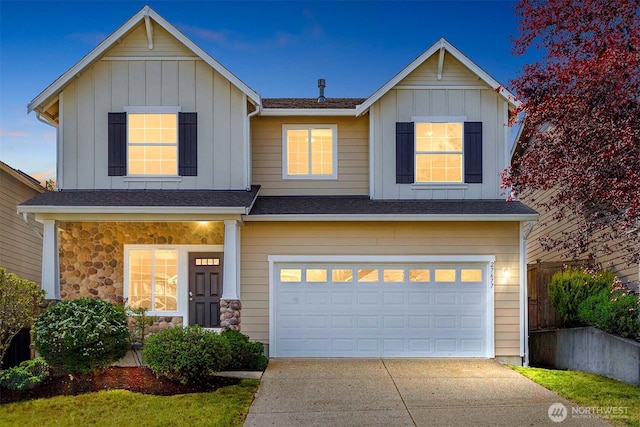 27677 256th Pl SE, Maple Valley, WA 98038 - view of front of property featuring board and batten siding, a garage, driveway, and a shingled roof