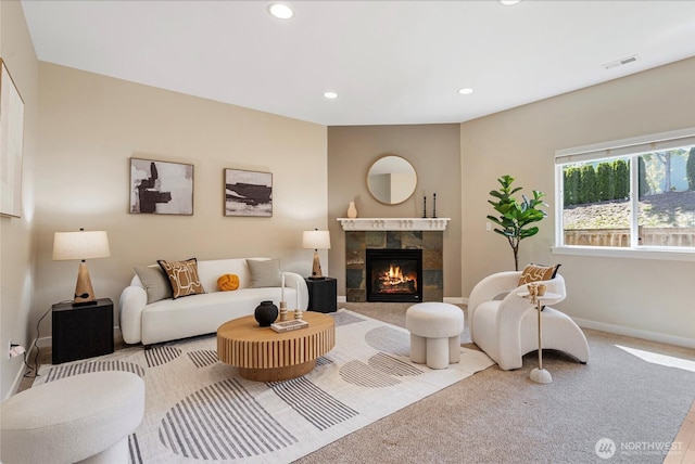 27677 256th Pl SE, Maple Valley, WA 98038 - living room with recessed lighting, a tiled fireplace, baseboards, and carpet flooring