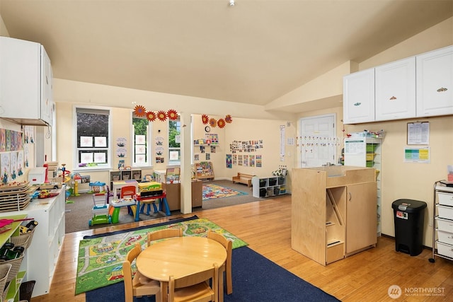 740 4th Ave NW, Issaquah, WA 98027 - kitchen featuring light wood-style flooring, white cabinets, and vaulted ceiling