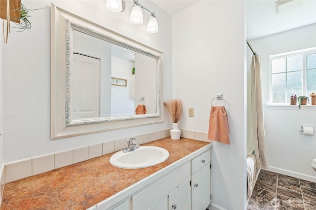 5110 Regan Rd, Cashmere, WA 98815 - bathroom featuring vanity, shower / bath combo with shower curtain, and toilet