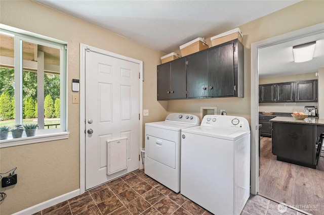 5110 Regan Rd, Cashmere, WA 98815 - laundry room with cabinet space, separate washer and dryer, and baseboards