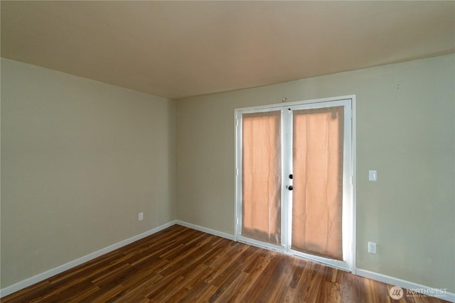 9528 Densmore Ave N, Seattle, WA 98103 - empty room with dark wood-type flooring and baseboards