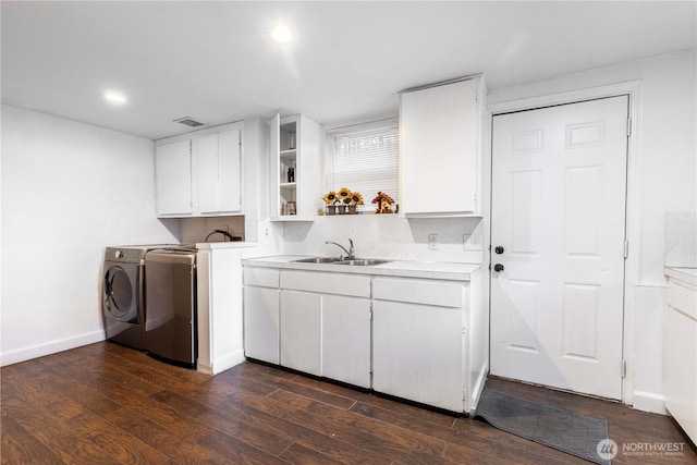 15819 42nd Ave S, Tukwila, WA 98188 - washroom featuring cabinet space, washing machine and clothes dryer, dark wood-style floors, recessed lighting, and baseboards