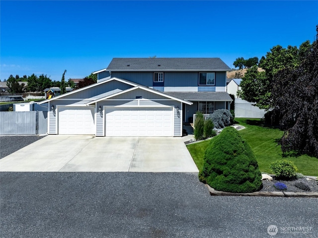 7690 Mcdougall Ave NE, Moses Lake, WA 98837 - traditional-style home featuring concrete driveway, an attached garage, and roof with shingles