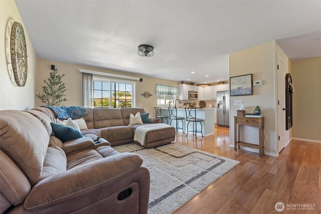 7690 Mcdougall Ave NE, Moses Lake, WA 98837 - living area with light wood-style floors, recessed lighting, and baseboards