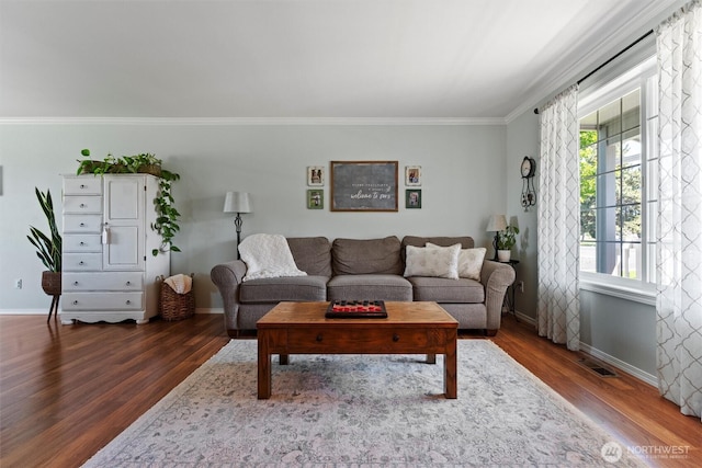 7690 Mcdougall Ave NE, Moses Lake, WA 98837 - living room featuring dark wood-style flooring, ornamental molding, and baseboards
