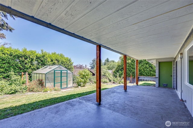 434 T St, Port Townsend, WA 98368 - view of patio / terrace featuring a greenhouse and an outdoor structure